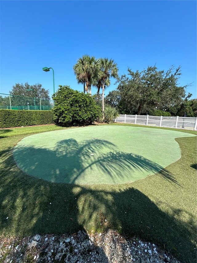 view of property's community with a lawn