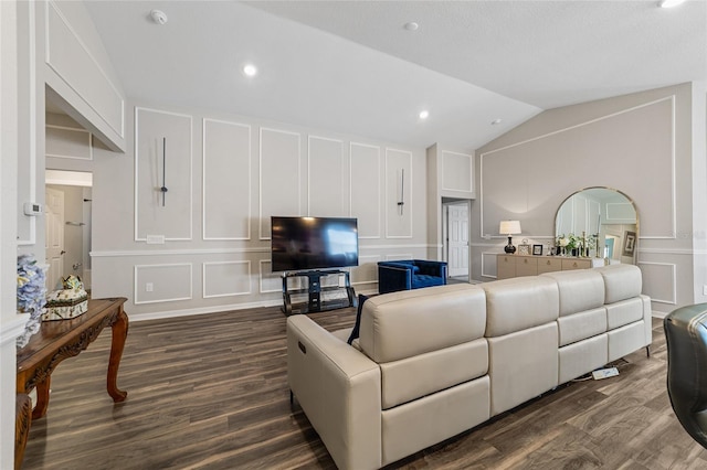 living room with vaulted ceiling and dark hardwood / wood-style floors