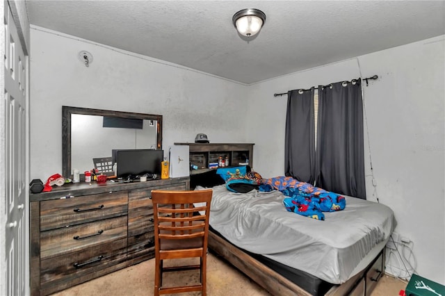 carpeted bedroom with a textured ceiling