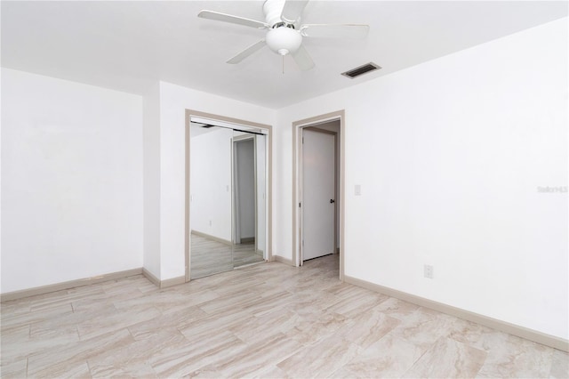 spare room with ceiling fan