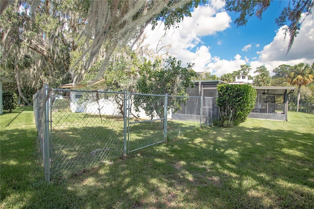 view of yard featuring a sunroom