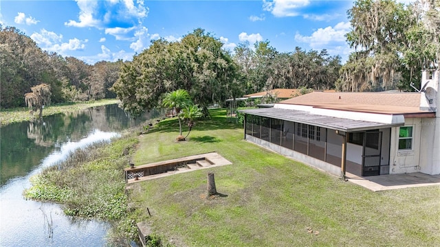 view of property's community featuring a water view and a lawn