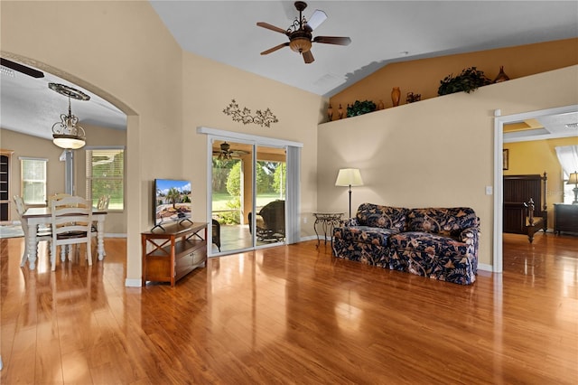 sitting room with ceiling fan, hardwood / wood-style flooring, and vaulted ceiling