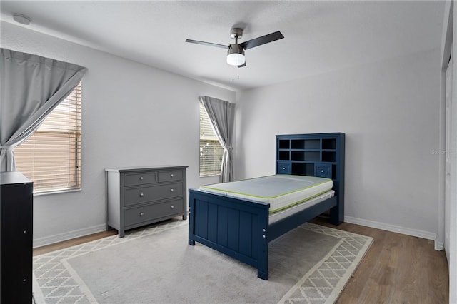 bedroom featuring ceiling fan and light hardwood / wood-style floors