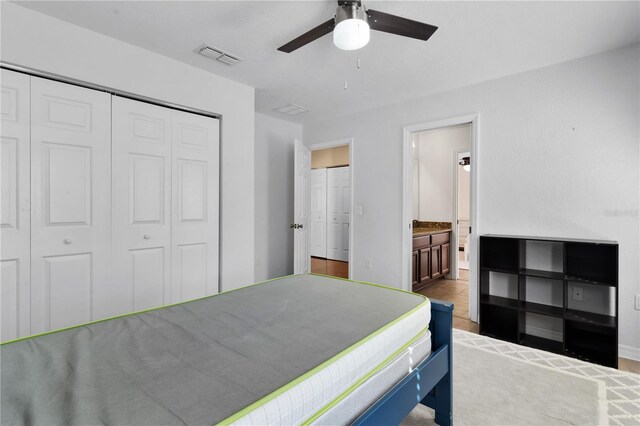 bedroom featuring ceiling fan and ensuite bathroom