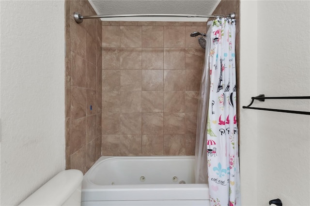 bathroom with shower / bath combo and toilet