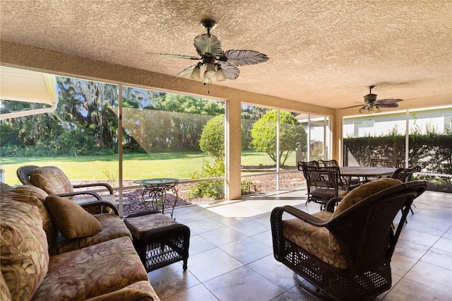 sunroom / solarium with ceiling fan