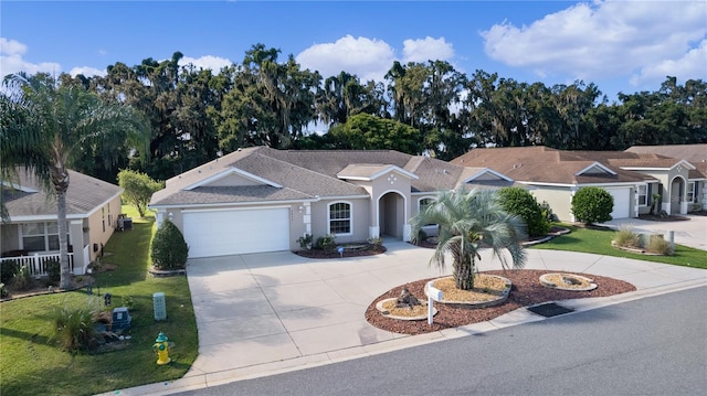 single story home featuring a front lawn and a garage