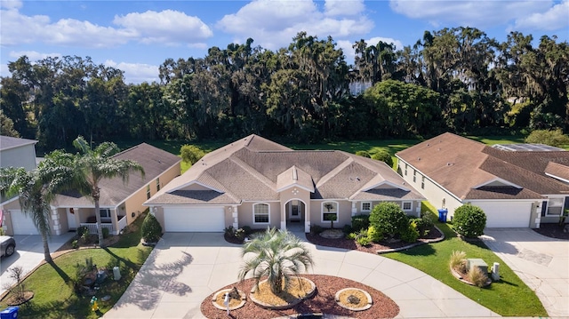 view of front of home with a front lawn and a garage