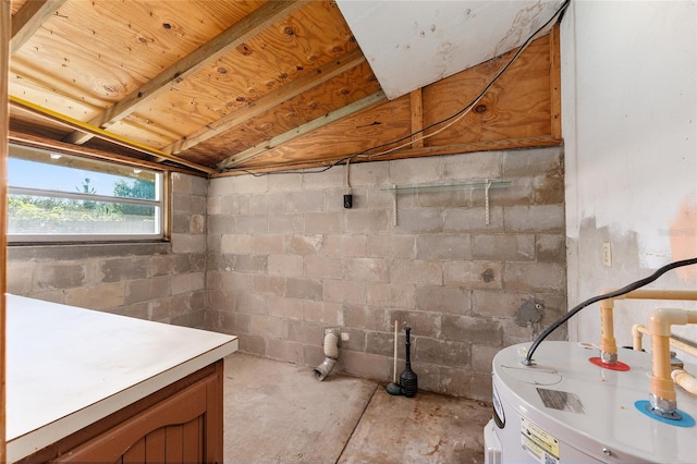 bathroom featuring concrete flooring and water heater