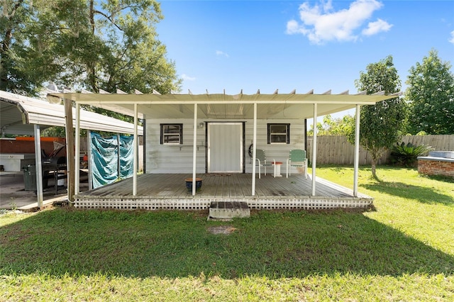 exterior space featuring a yard and a carport