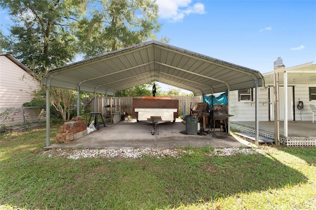 view of parking featuring a lawn and a carport