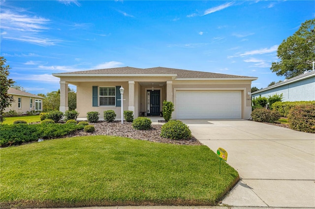 view of front of home featuring a front yard and a garage