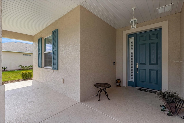 doorway to property with covered porch