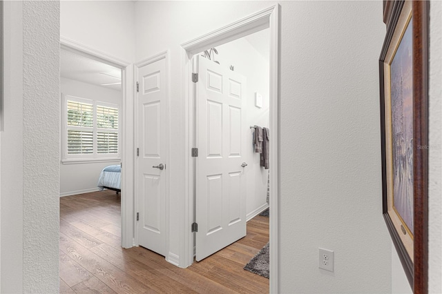 hall with light hardwood / wood-style floors