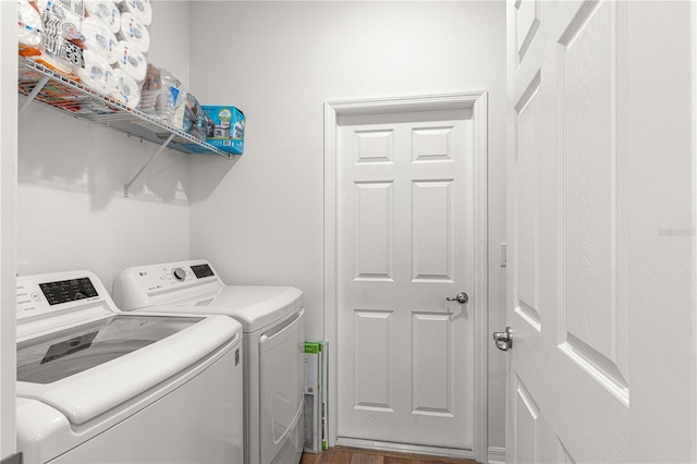 washroom featuring independent washer and dryer and dark hardwood / wood-style flooring