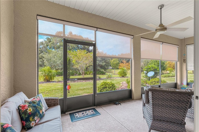 sunroom / solarium with ceiling fan and plenty of natural light