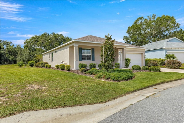 ranch-style home featuring a garage and a front yard