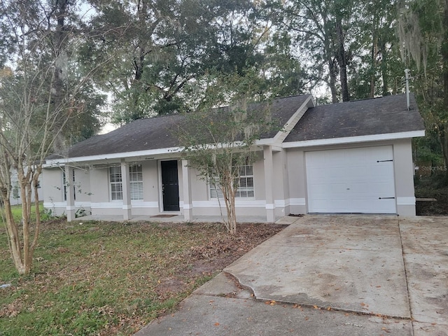 ranch-style home with covered porch and a garage