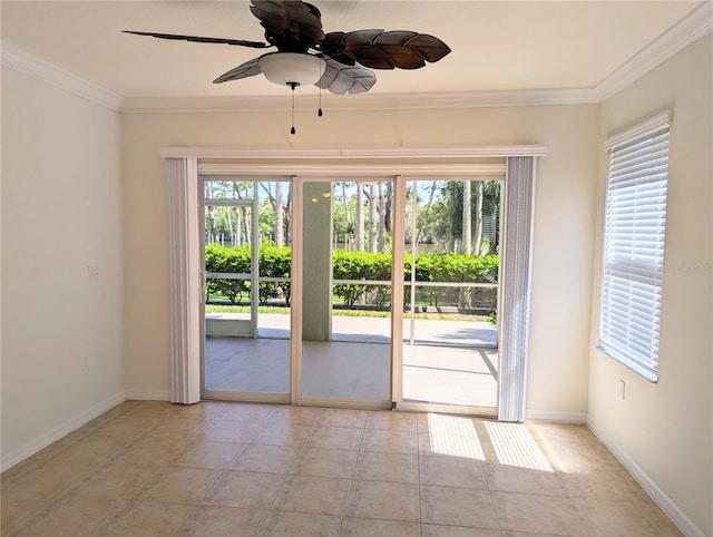 tiled spare room with crown molding, a wealth of natural light, and ceiling fan