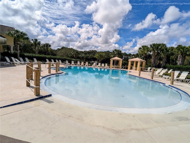 view of swimming pool featuring a patio area