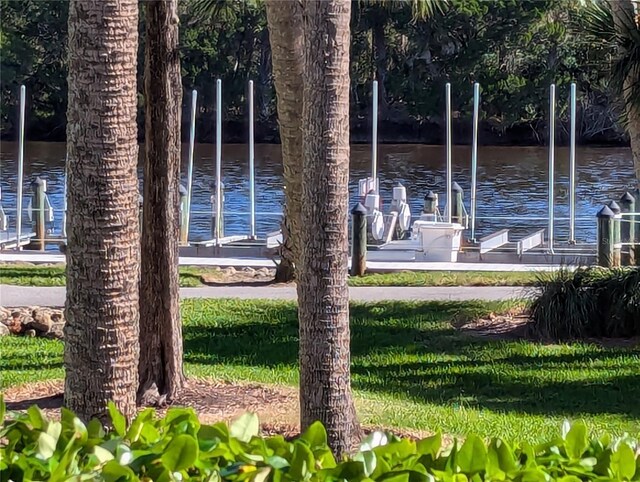 surrounding community featuring a water view