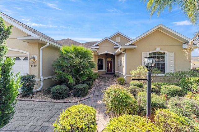 single story home with a garage