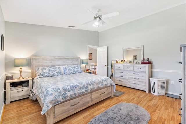 bedroom with ceiling fan and light hardwood / wood-style flooring