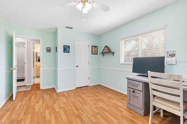 home office featuring ceiling fan and light hardwood / wood-style floors