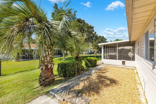 view of yard featuring a sunroom