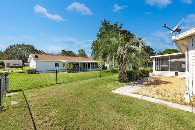 view of yard featuring a sunroom