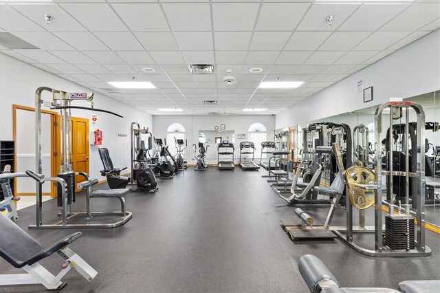 workout area featuring a paneled ceiling