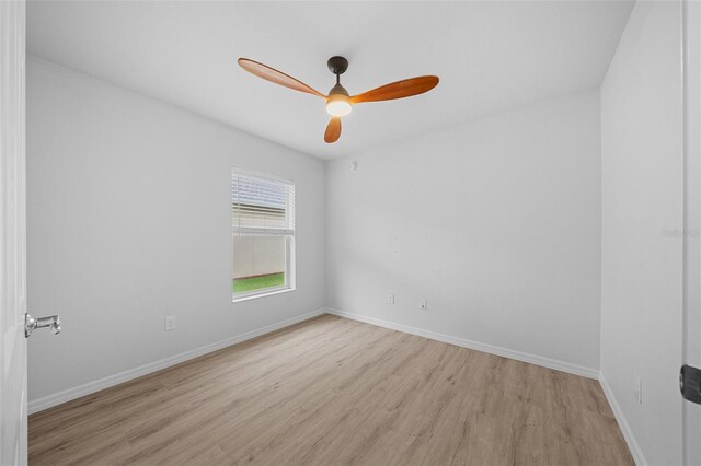 unfurnished room featuring light wood-type flooring and ceiling fan