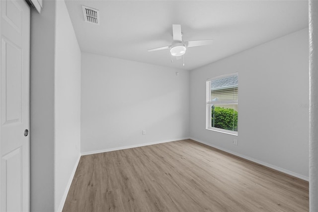 unfurnished room featuring light wood-type flooring and ceiling fan