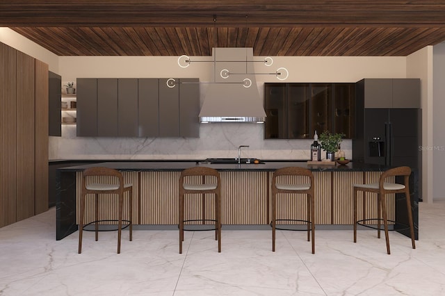 kitchen with tasteful backsplash, dark brown cabinets, custom range hood, a kitchen breakfast bar, and wood ceiling