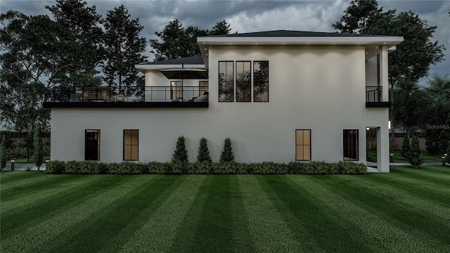 view of home's exterior featuring a yard and a balcony