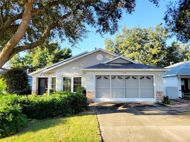 single story home with a garage