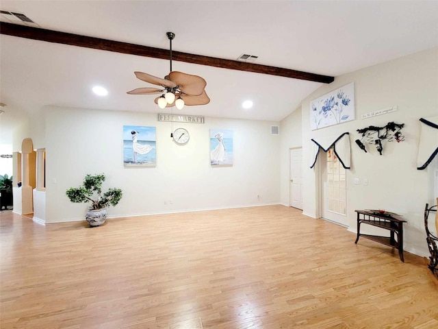 workout room with light hardwood / wood-style floors, vaulted ceiling, and ceiling fan