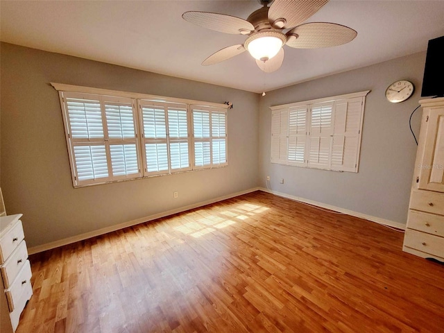 unfurnished bedroom with light hardwood / wood-style flooring, multiple windows, and ceiling fan