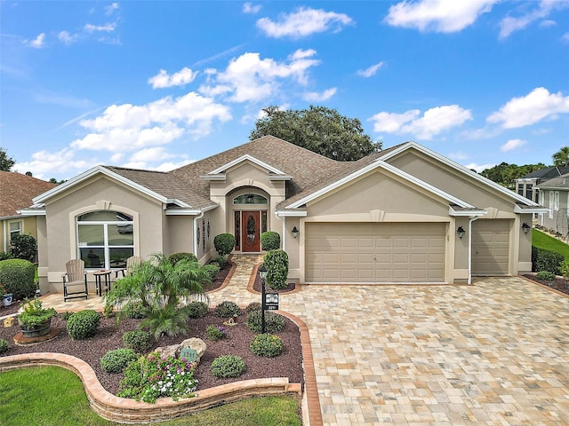 ranch-style house featuring a garage