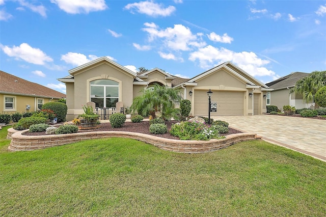 ranch-style home with a garage and a front lawn