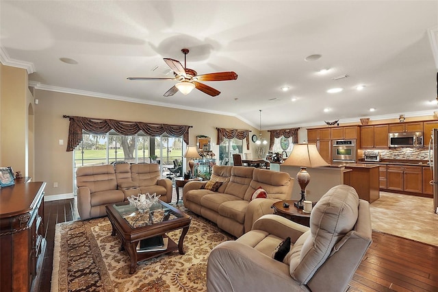 living room with ceiling fan, dark hardwood / wood-style floors, and ornamental molding