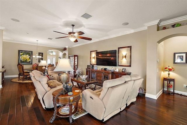 living room with ceiling fan with notable chandelier, dark hardwood / wood-style floors, and crown molding