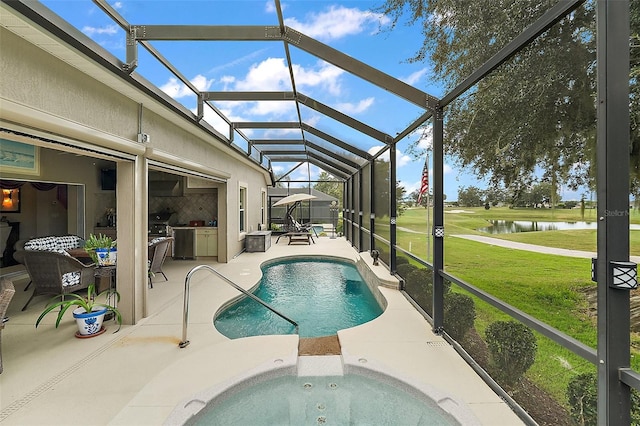 view of swimming pool featuring a jacuzzi, a patio, glass enclosure, a lawn, and a water view