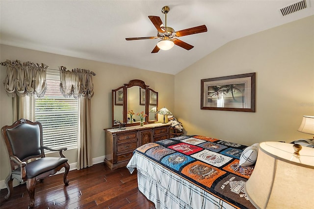 bedroom with vaulted ceiling, dark hardwood / wood-style floors, and ceiling fan