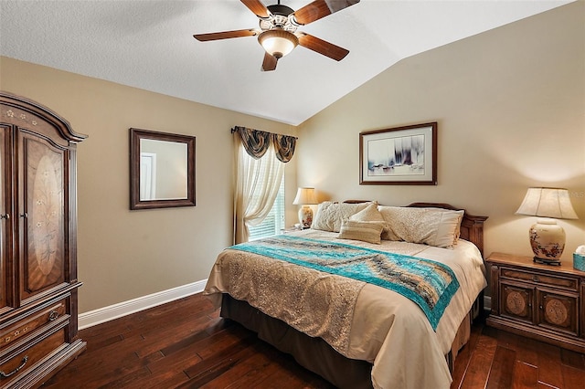 bedroom featuring vaulted ceiling, ceiling fan, and dark hardwood / wood-style floors