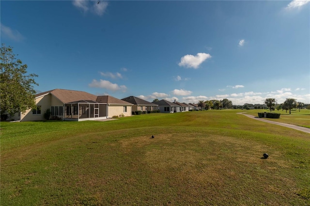 view of yard with a sunroom