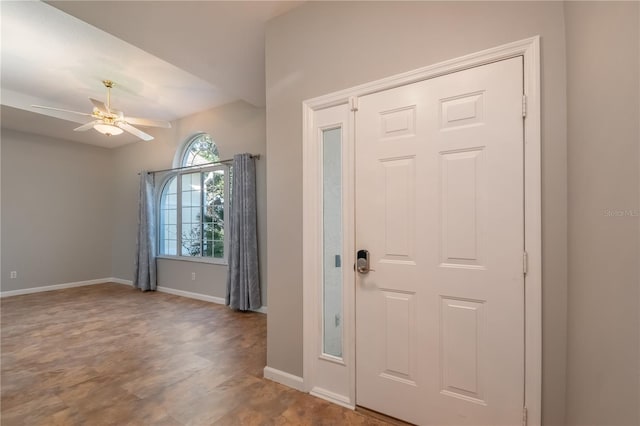 foyer entrance featuring ceiling fan