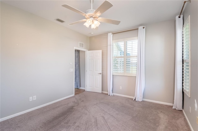 unfurnished bedroom featuring ceiling fan and light colored carpet