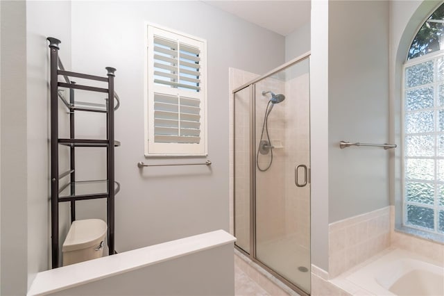 bathroom featuring independent shower and bath, tile patterned flooring, and toilet